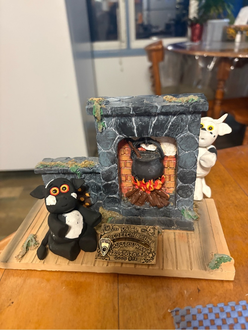 When playing with the Ouija board becomes too scary Cow hiding behind fireplace